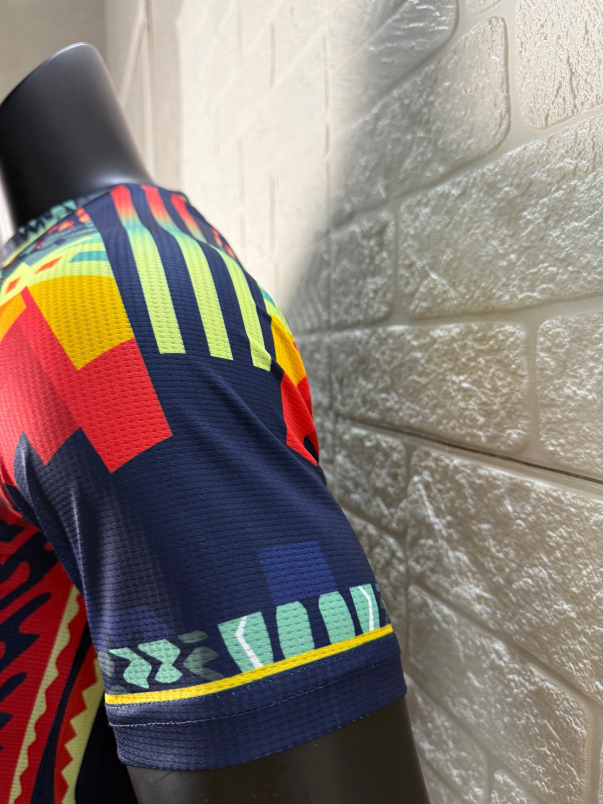 2025/26 Club América Training Player Version Jersey - Dark Navy Blue Body Multicolour Aztec Zigzag Graphic Upper Chest  - Gold Three Stripes - Club América Crest - Caliente Principal Sponsor