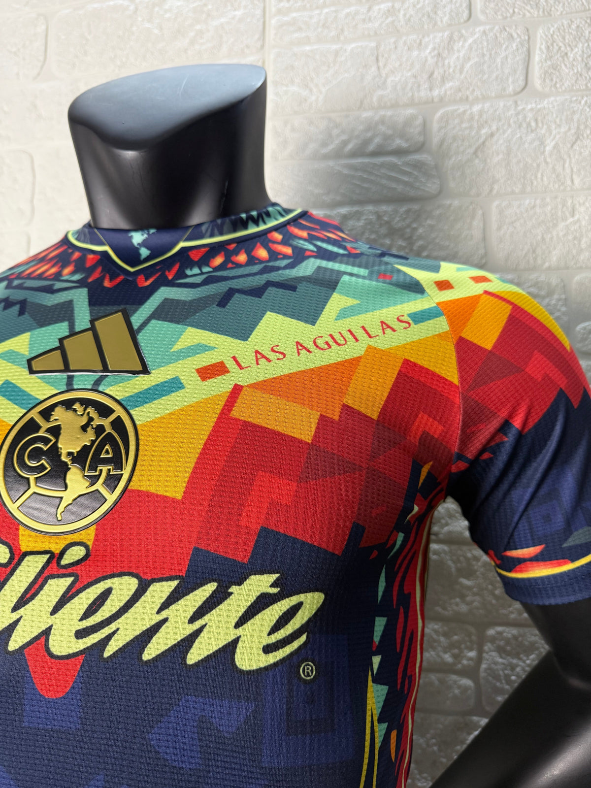 2025/26 Club América Training Player Version Jersey - Dark Navy Blue Body Multicolour Aztec Zigzag Graphic Upper Chest  - Gold Three Stripes - Club América Crest - Caliente Principal Sponsor